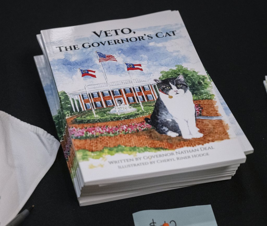 A book with a picture of a cat on it.