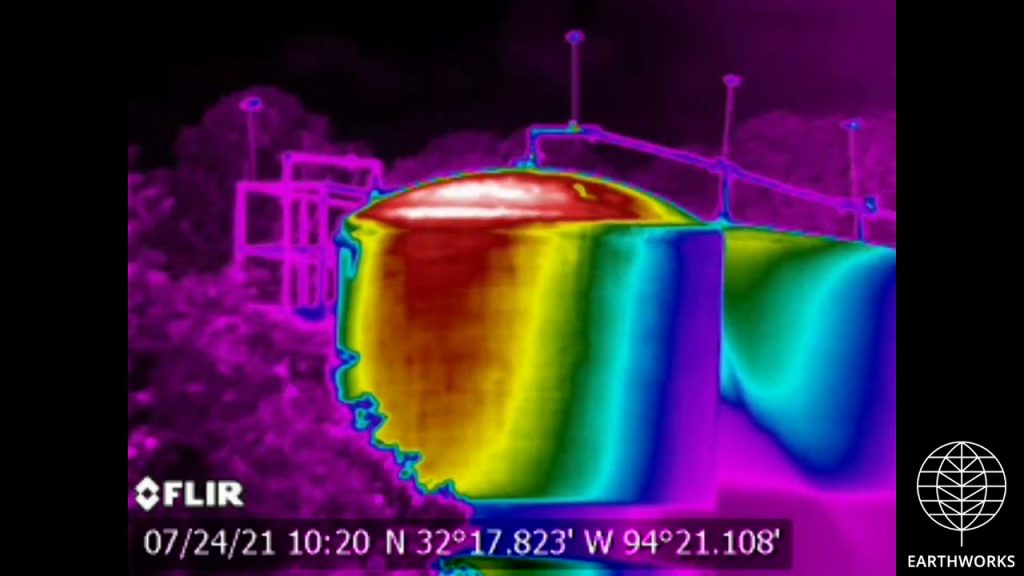 A thermal image of a water tank in the middle of a park.