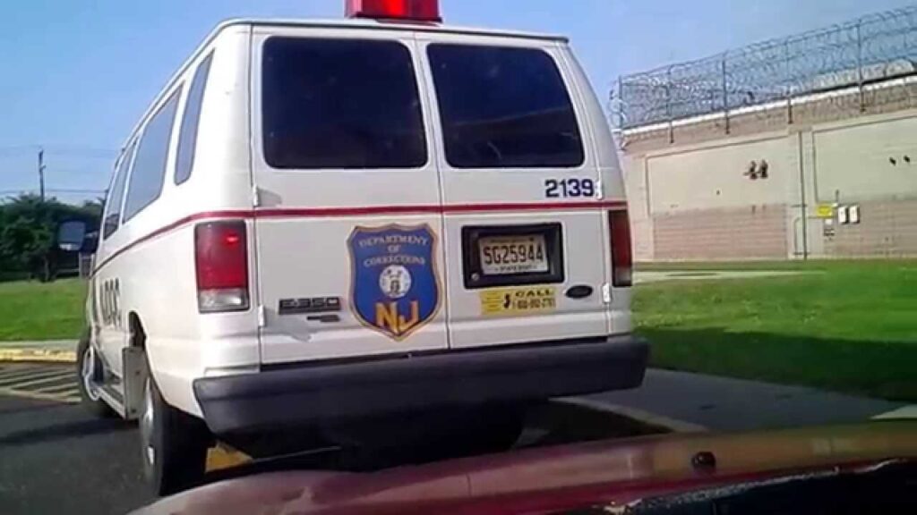 A van with the number 2 1 3 9 on it's back bumper.