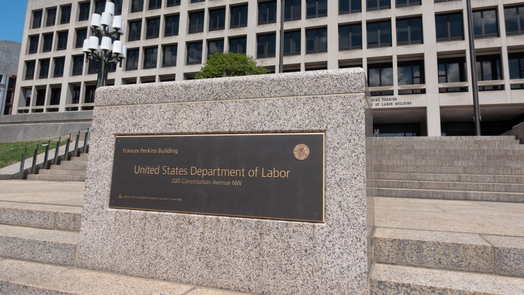 A sign in front of the united states department of labor.