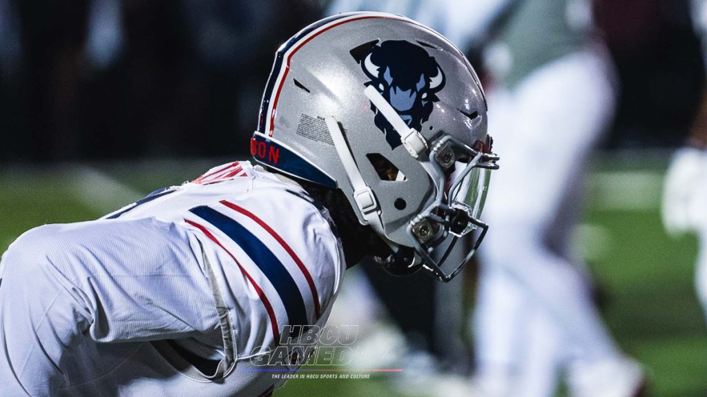 A close up of the helmet on a football player.