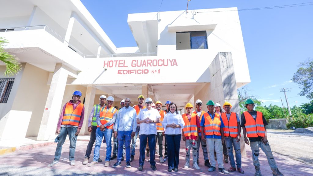 A group of people standing in front of a building.