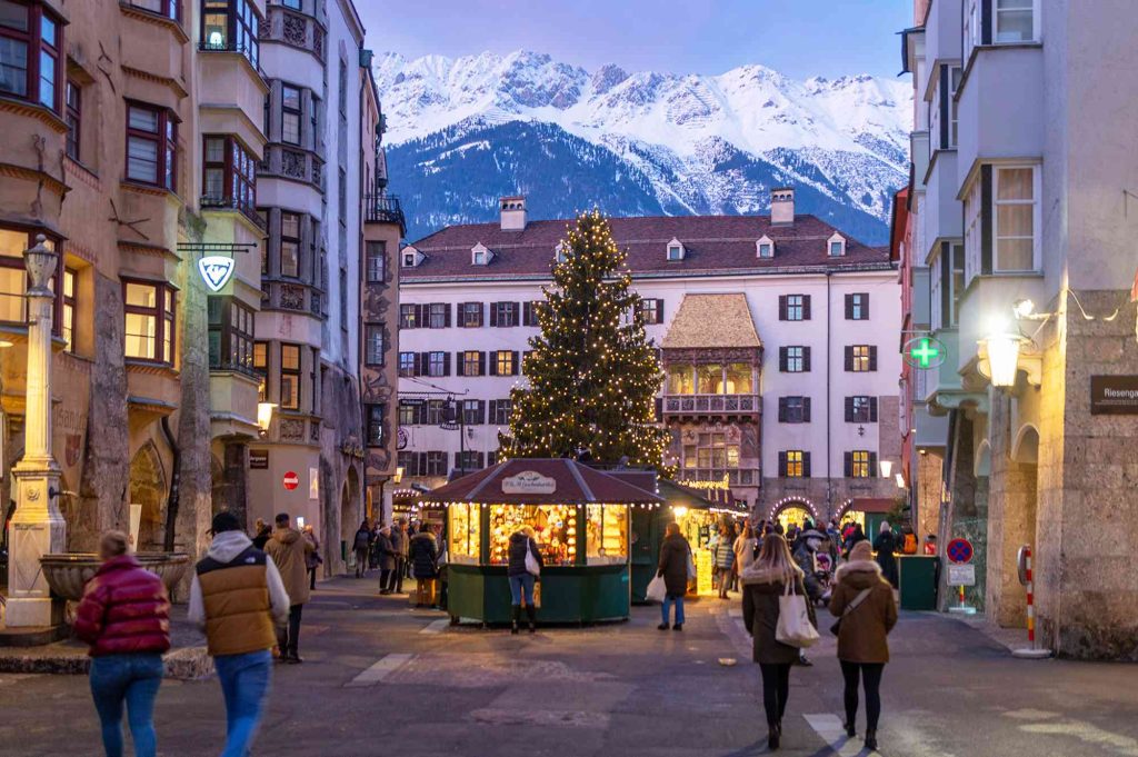 A christmas tree in the middle of a city.