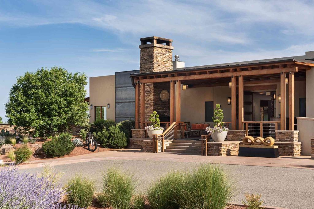 A building with a patio and a fire place.