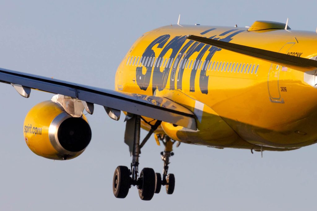 A yellow airplane with the name " spirit ".