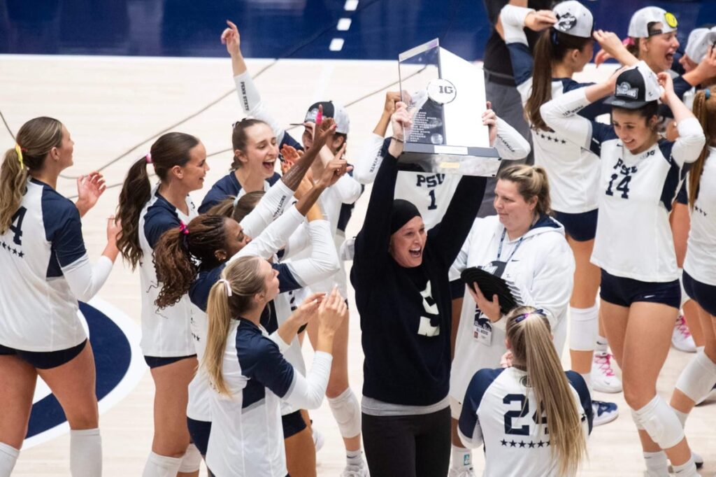 A group of women holding up their trophy.