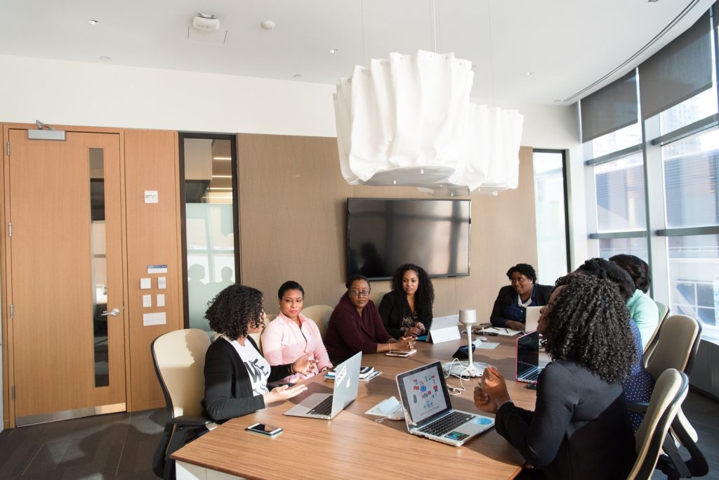 A group of people sitting around a table.