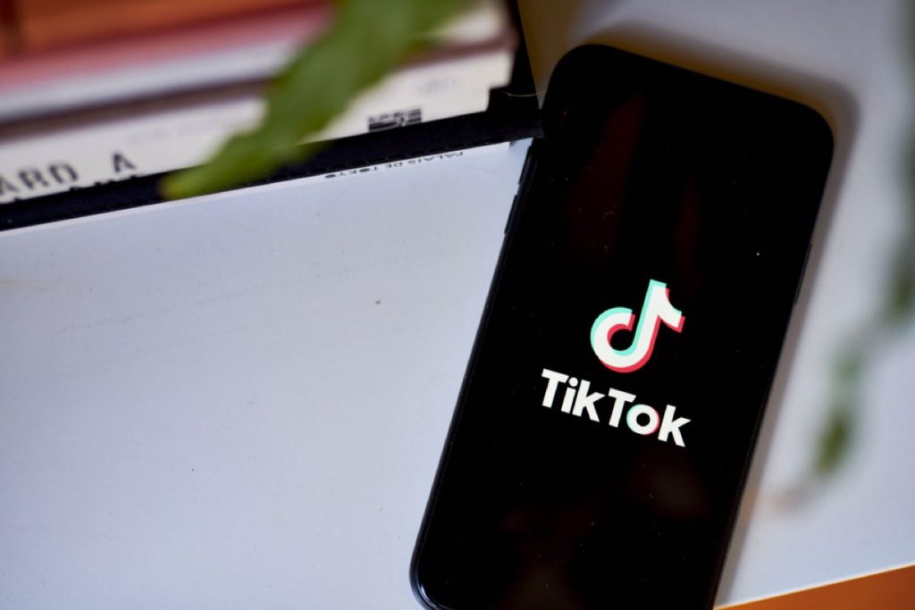 A close up of the tiktok logo on a phone