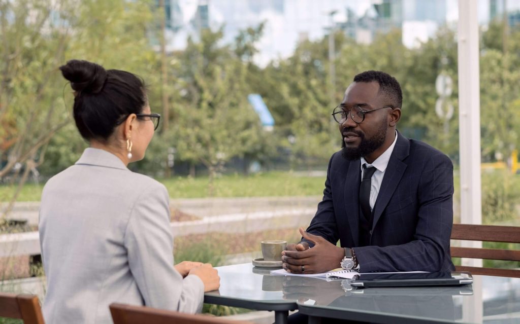 A man and woman are sitting at a table