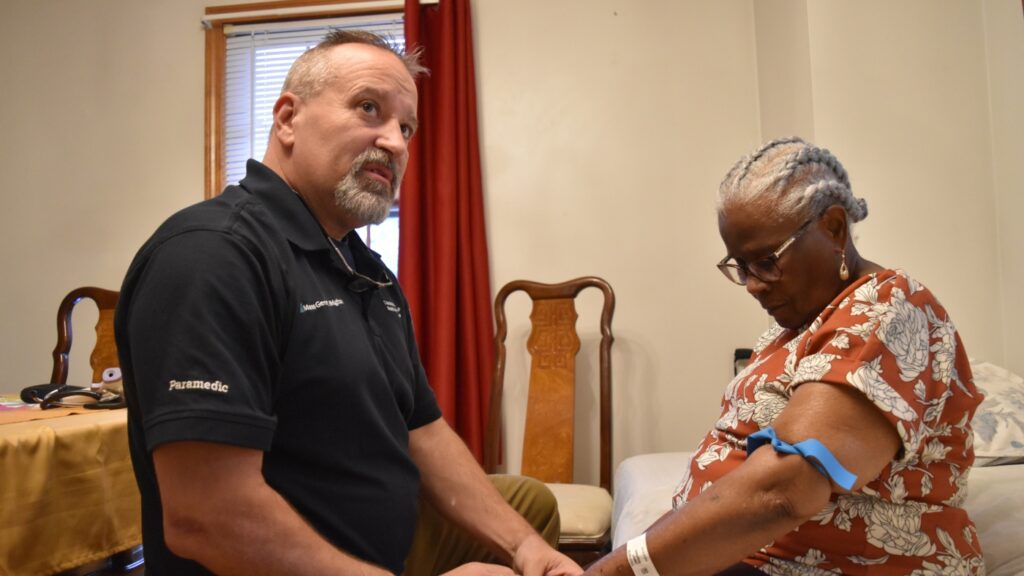 A man and woman are holding hands in the living room.