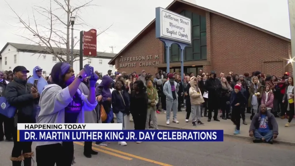 A crowd of people standing outside of a church.