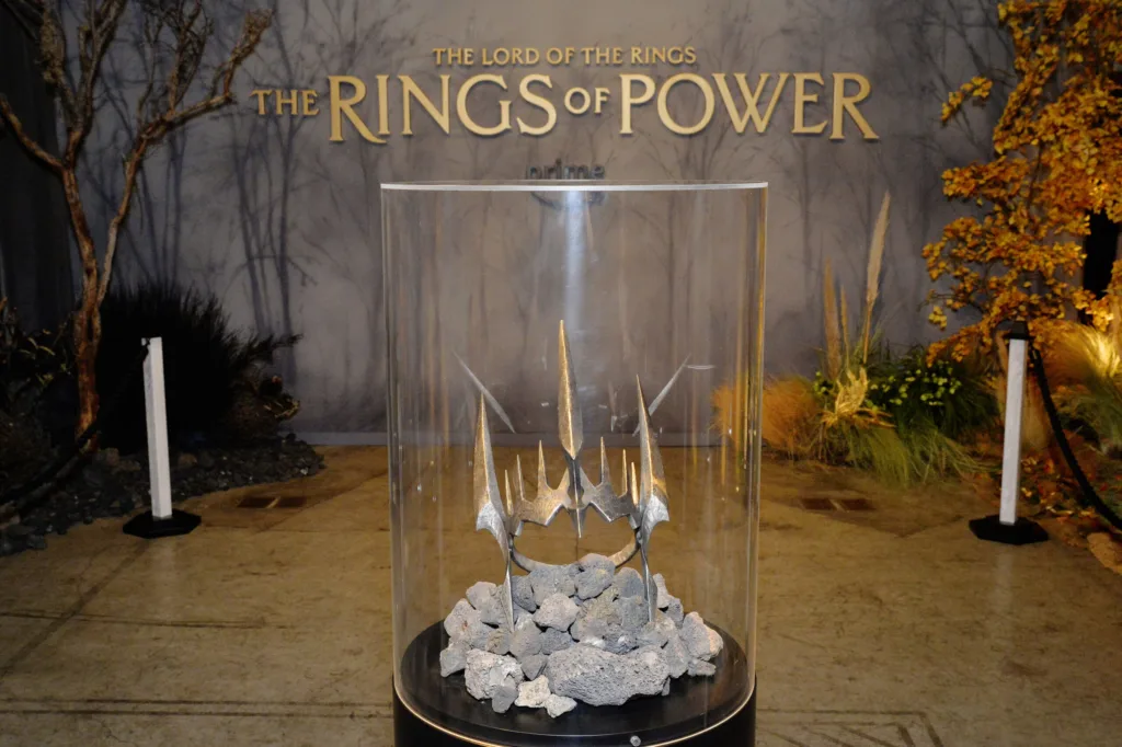 A display case with the rings of power logo on it.