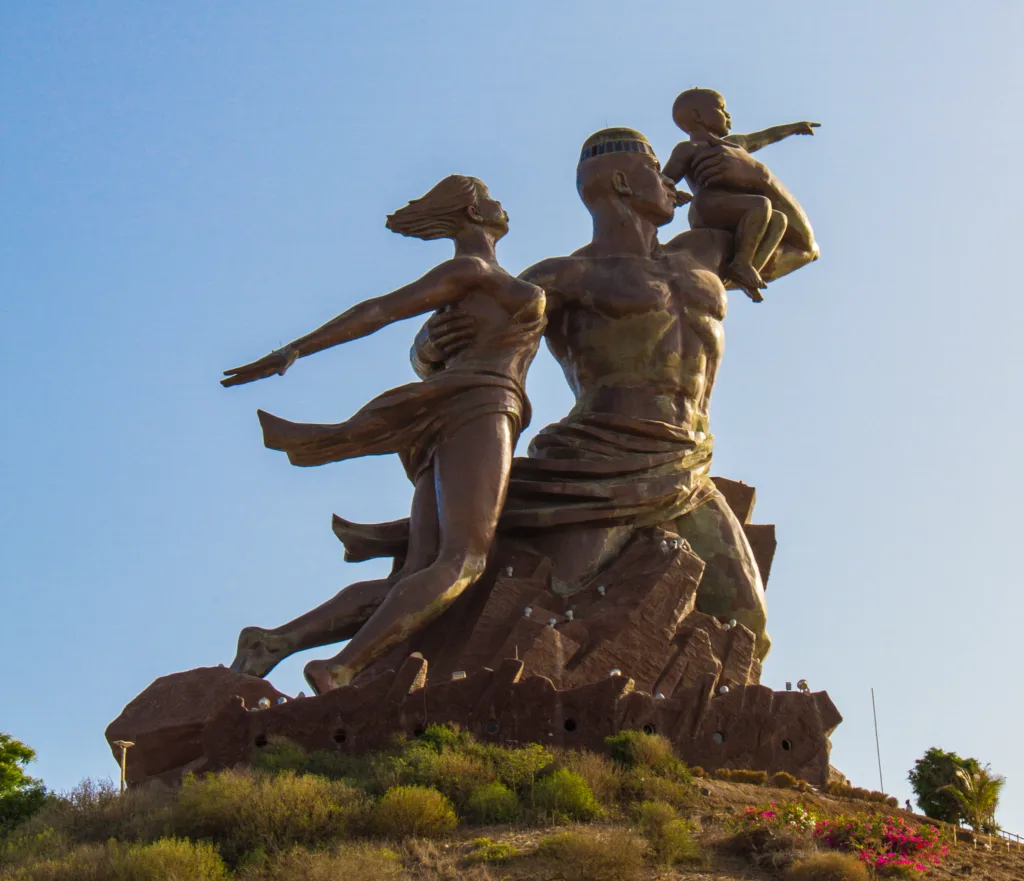 A statue of two women and a child.