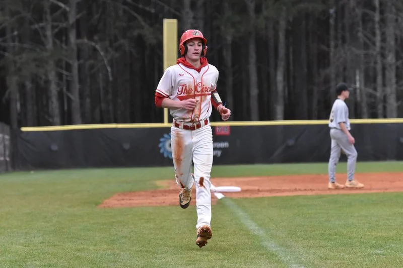 A baseball player running on the field