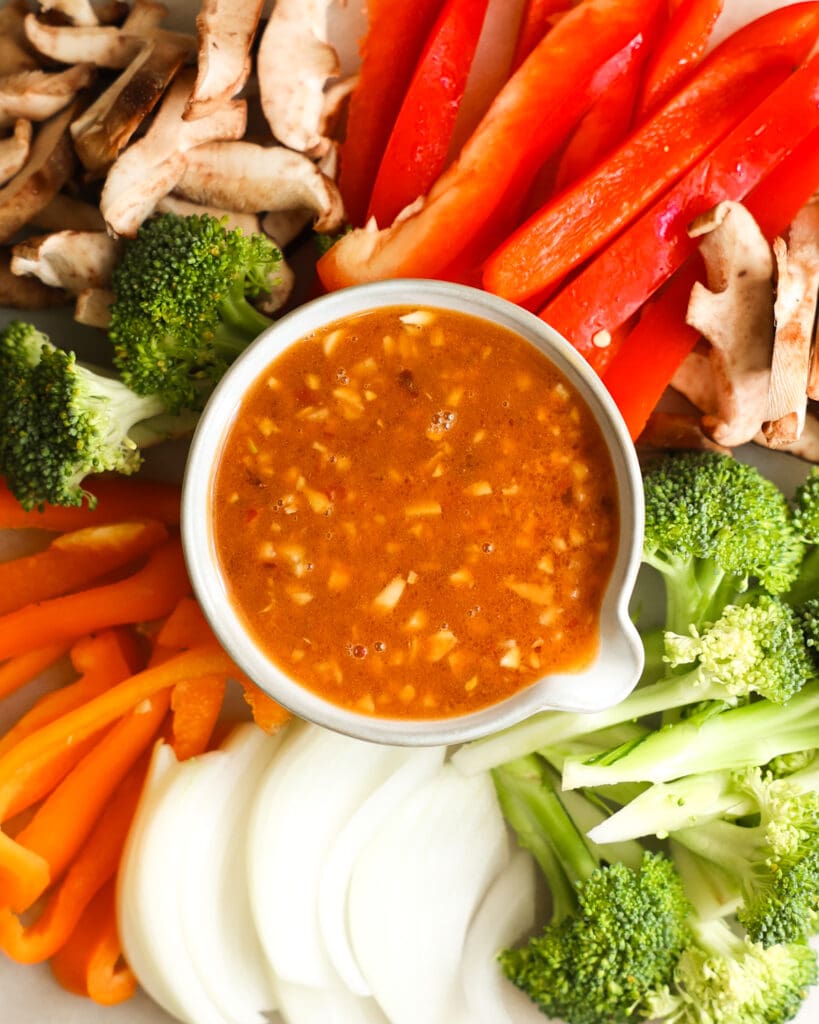 Stir Fry Sauce in bowl surrounded by veggies