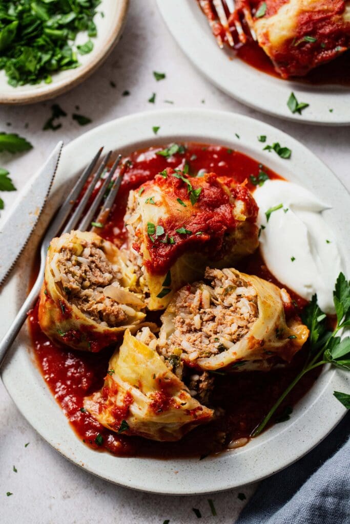 Stuffed cabbage rolls with tomato sauce.