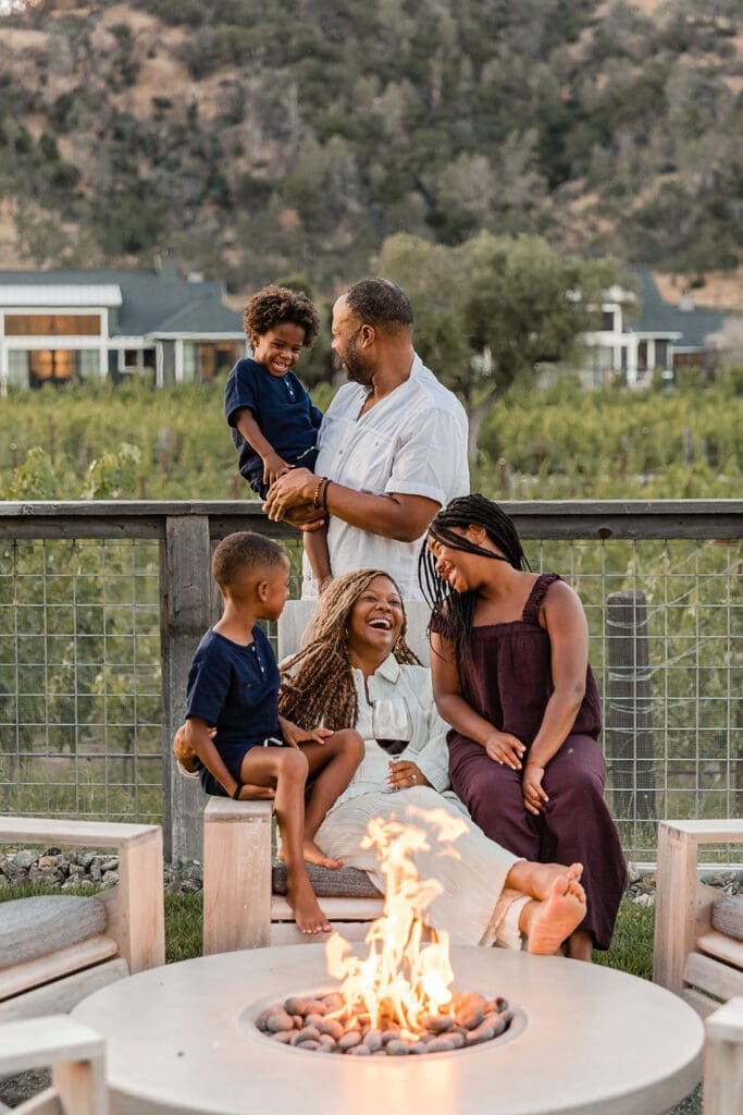 Personality Over Ability: Exactly How to Impart Long-lasting Job Values in Your Kids Family enjoying time by a fire pit.