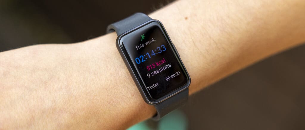 The Samsung Galaxy Fit 3 watch in grey worn on a female wrist