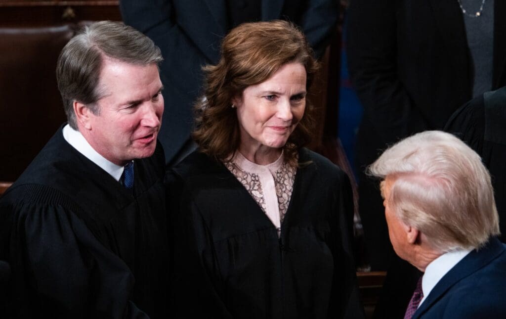Supreme Court Justices Brett Kavanaugh and Amy Coney Barrett greet President Donald Trump after his address to a joint session of Congress in the House Chamber of the U.S. Capitol on Tuesday, March 4, 2025.