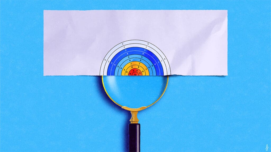 Magnifying glass revealing a colorful target.