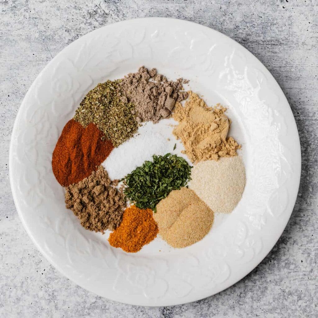 Homemade Peri Peri Spices – Reduced Carbohydrate Africa Assorted spices arranged on a white plate.