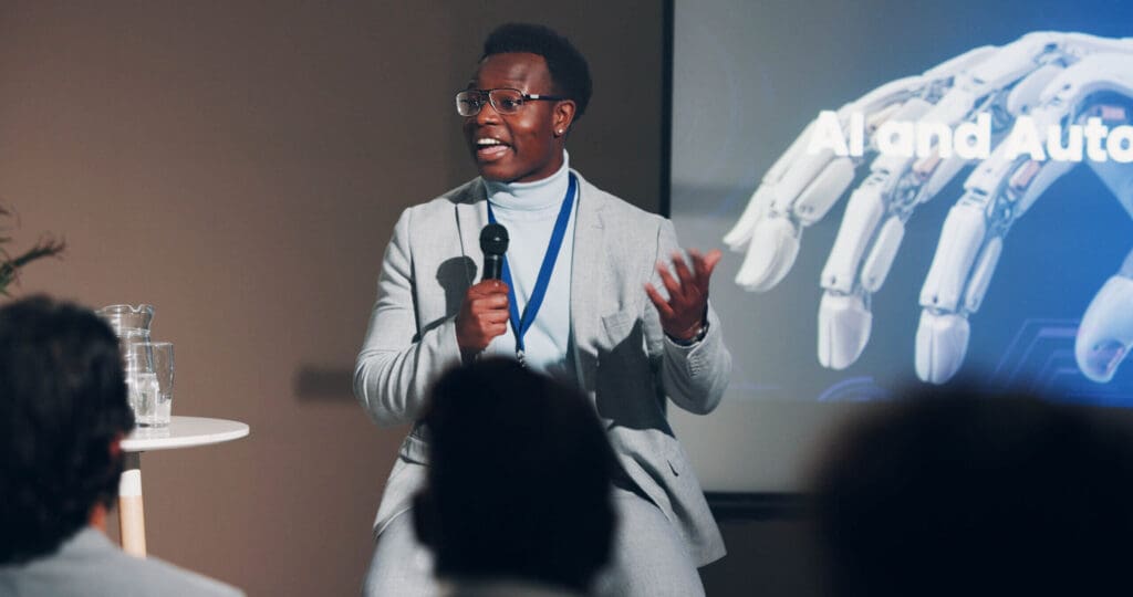 9 Executive Conferences Not to Miss in 2025 Black professional speaking at a conference