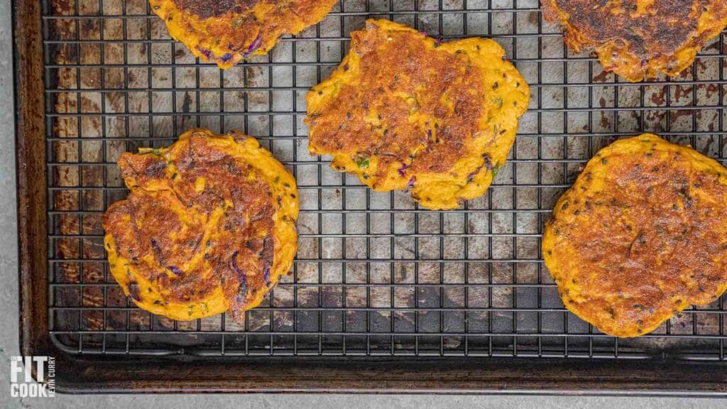 Pumpkin fritters on a wire cooling rack.