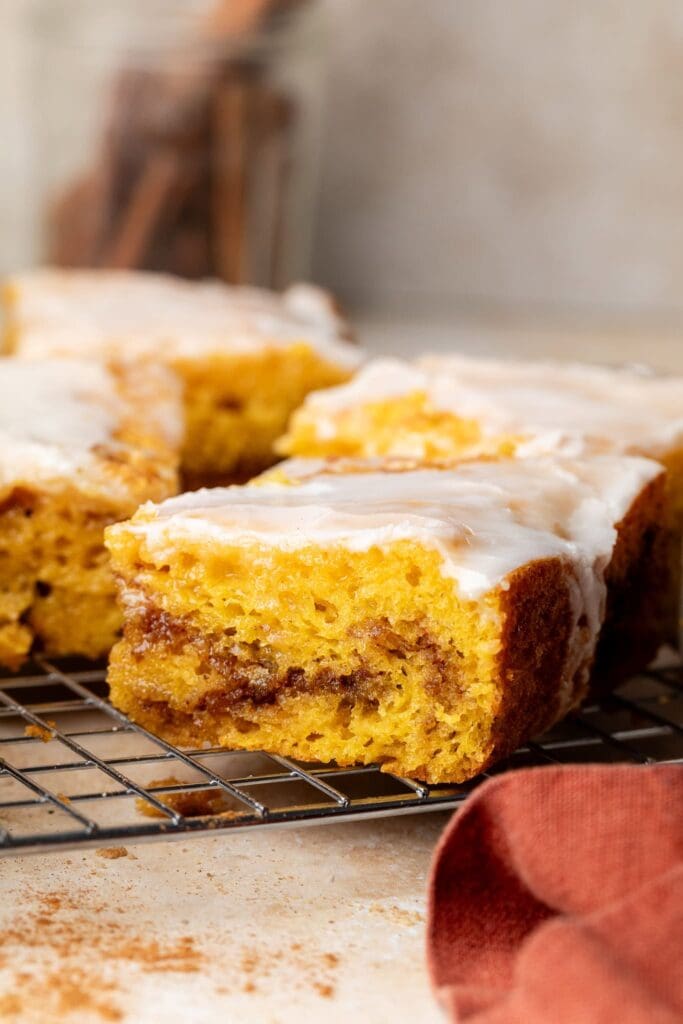 sweet potato honey bun cake slice on wire rack