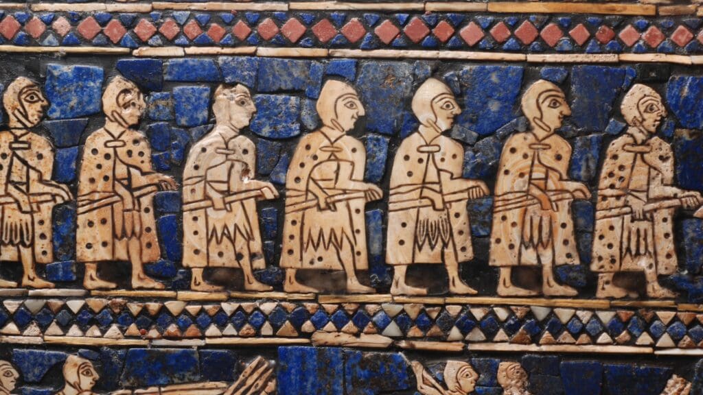 Mesopotamia test: Evaluate your expertise regarding the old worlds of the Fertile Crescent A tile mosaic with a blue background and light-colored men in a line with geometric decorations