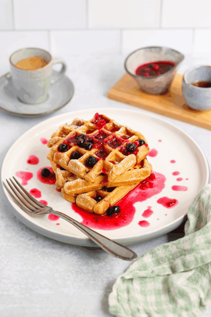 Fluffy Vegan Waffles (Blood Sugar and Diabetes-Friendly) » Hangry Woman® Waffles with berry syrup and coffee.