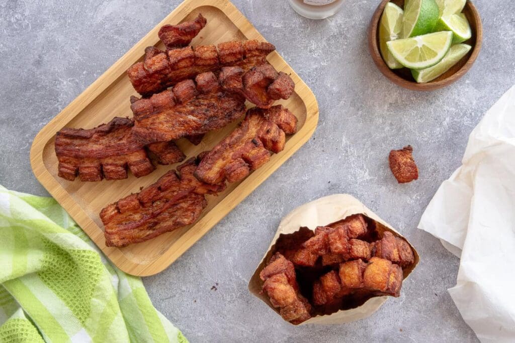 Fried pork belly with lime and napkin.