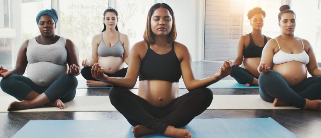 Women meditating while pregnant