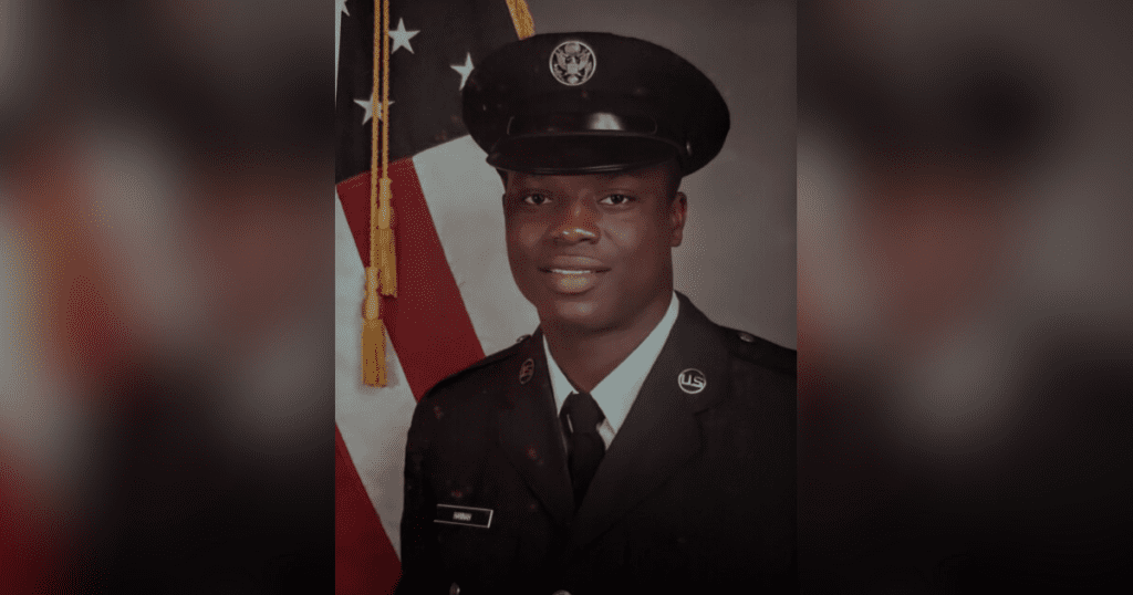 U.S. Air Force member in uniform, smiling.