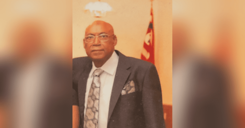 Man in suit with a patterned tie.