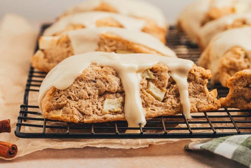 Apple cinnamon scones on a wire rack.