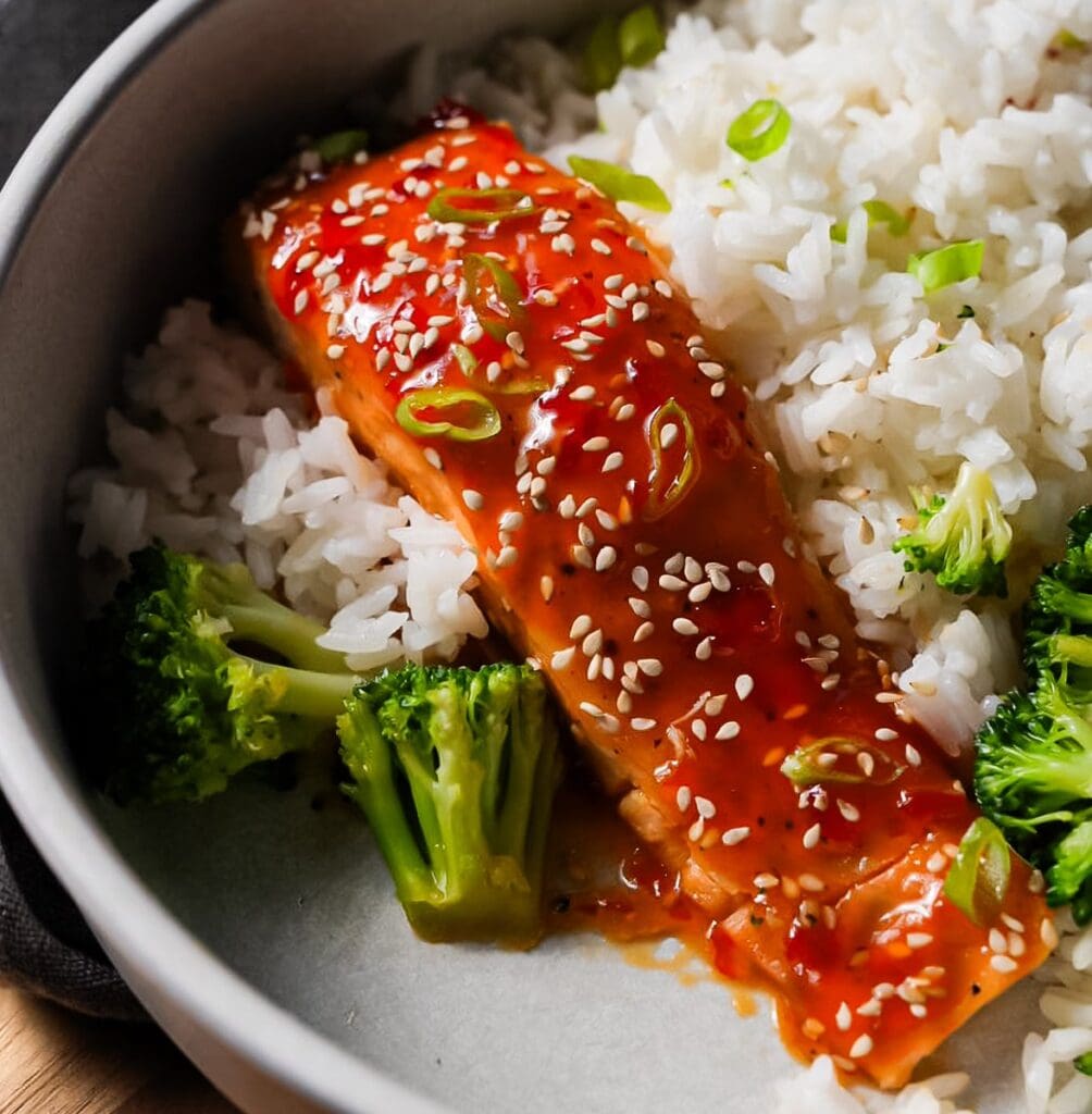 Salmon, rice, and broccoli with sesame seeds.