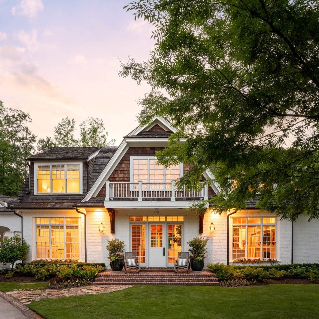 Exterior view of a luxury home at 5360 Lake Forrest with landscaped front yard and driveway in Atlanta