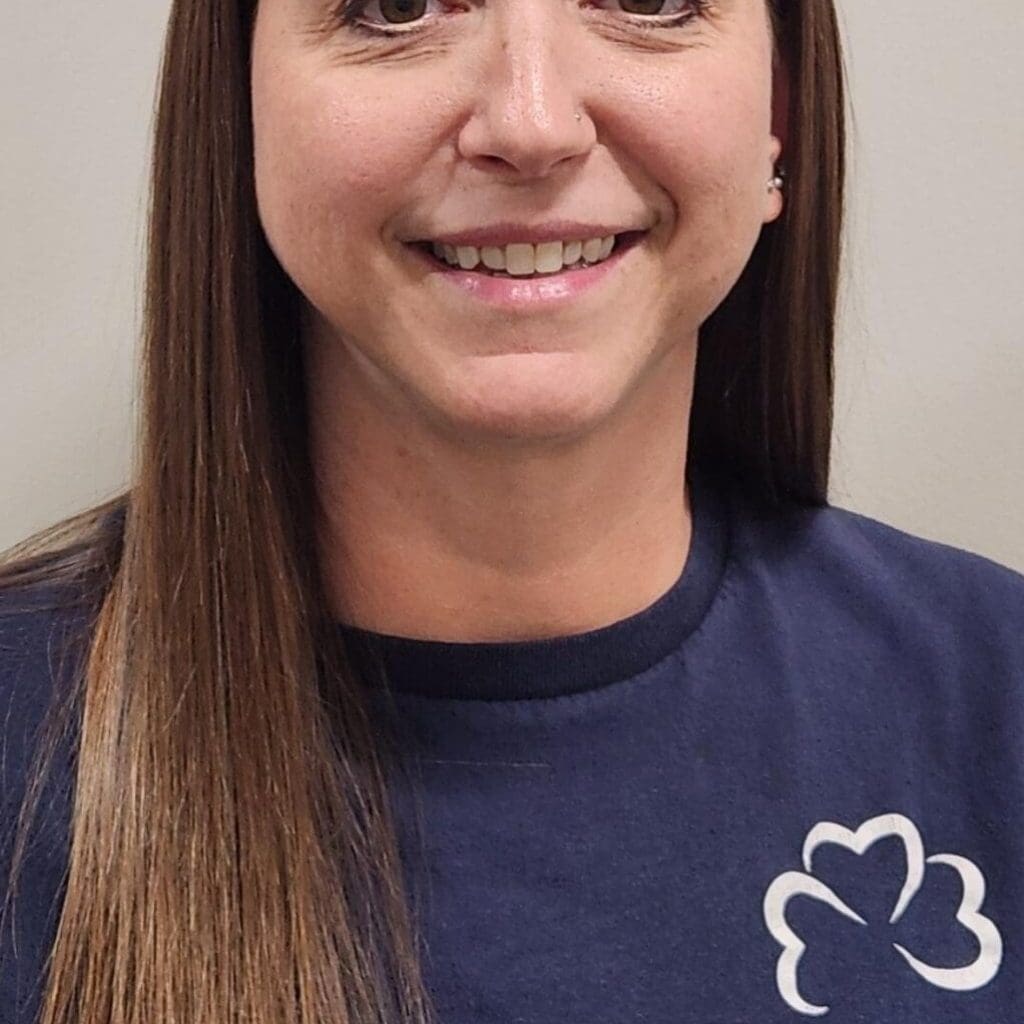 Young lady in a blue shirt smiling