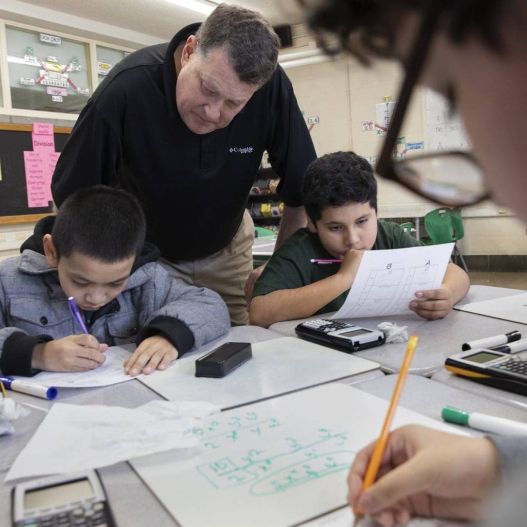 Male teacher with students