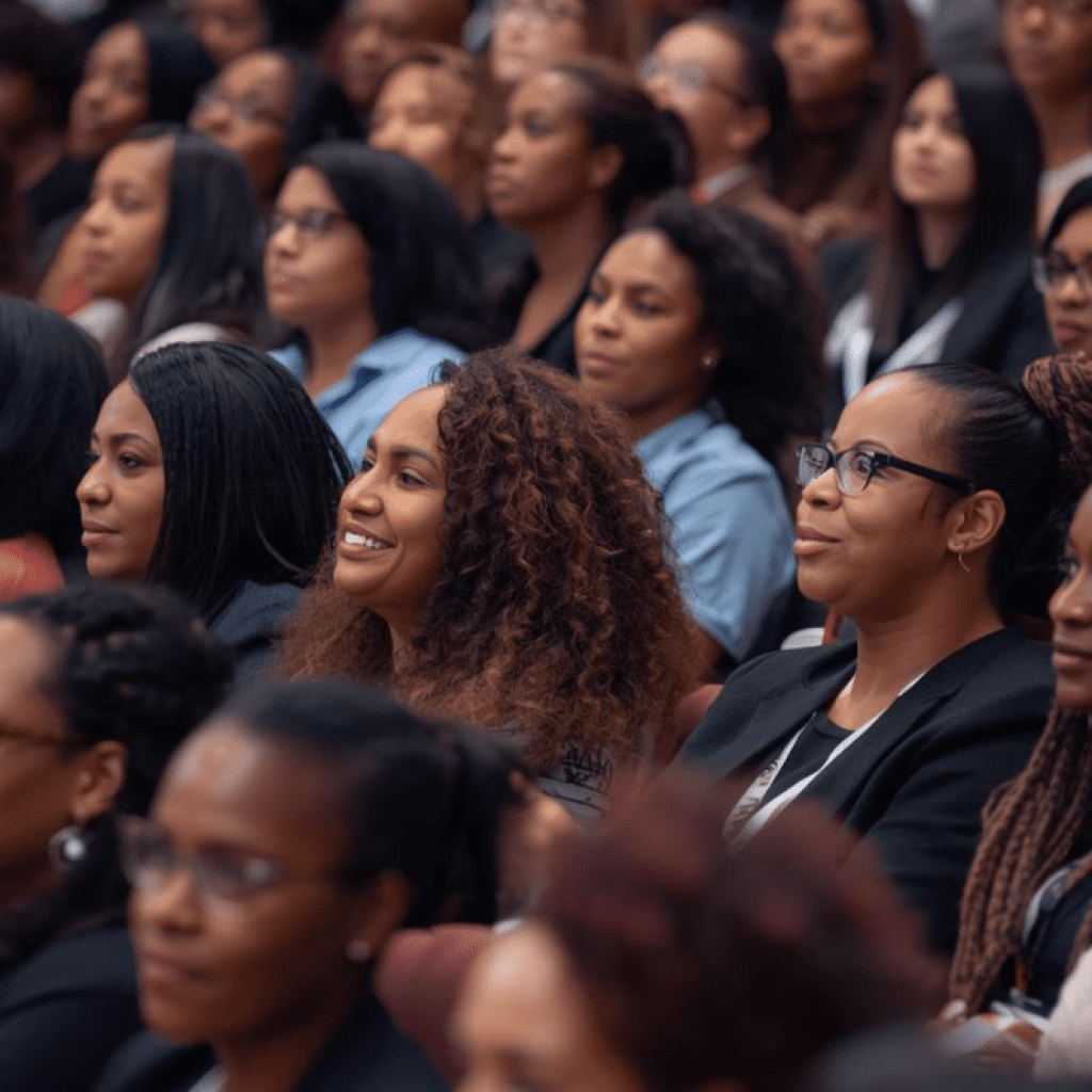 Black women entrepreneurs attending a business conference focused on networking, leadership, and growth