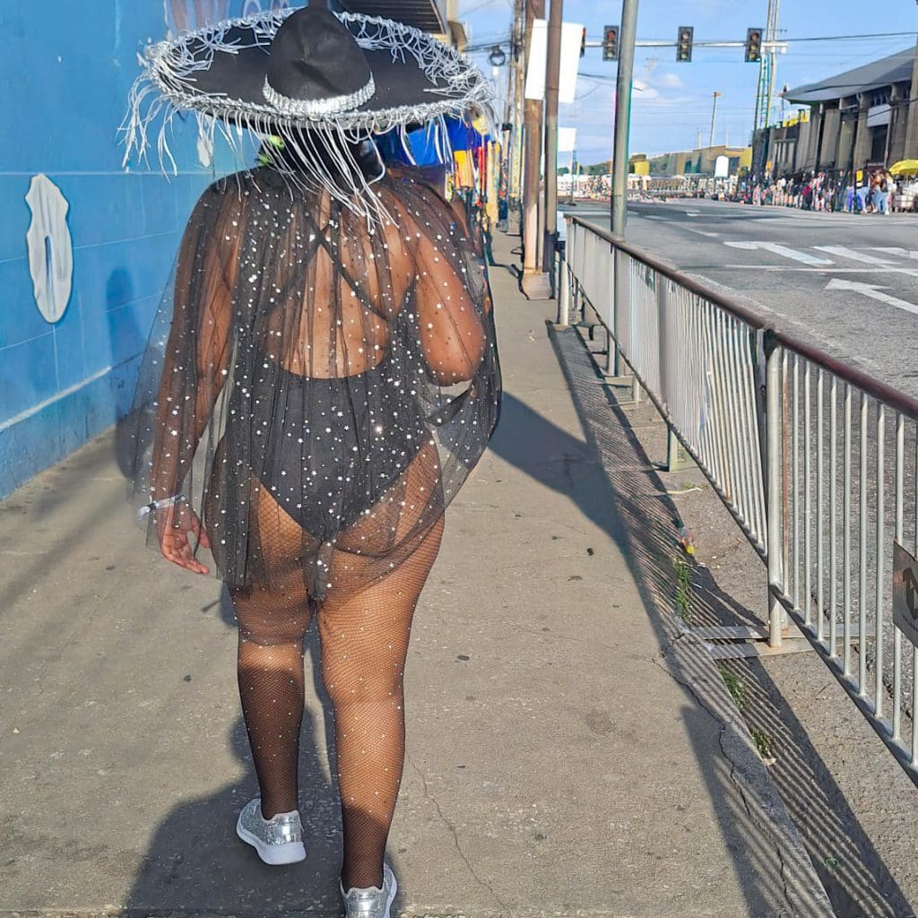 Masquerader walking through Port of Spain, Trinidad on Carnival Monday
