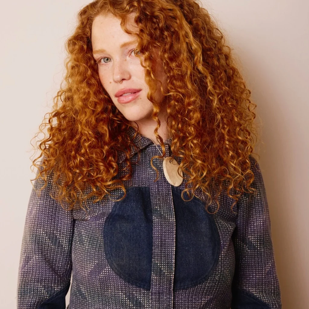 Defined natural curls styled with Milbon Curl Collection for frizz control and hydration