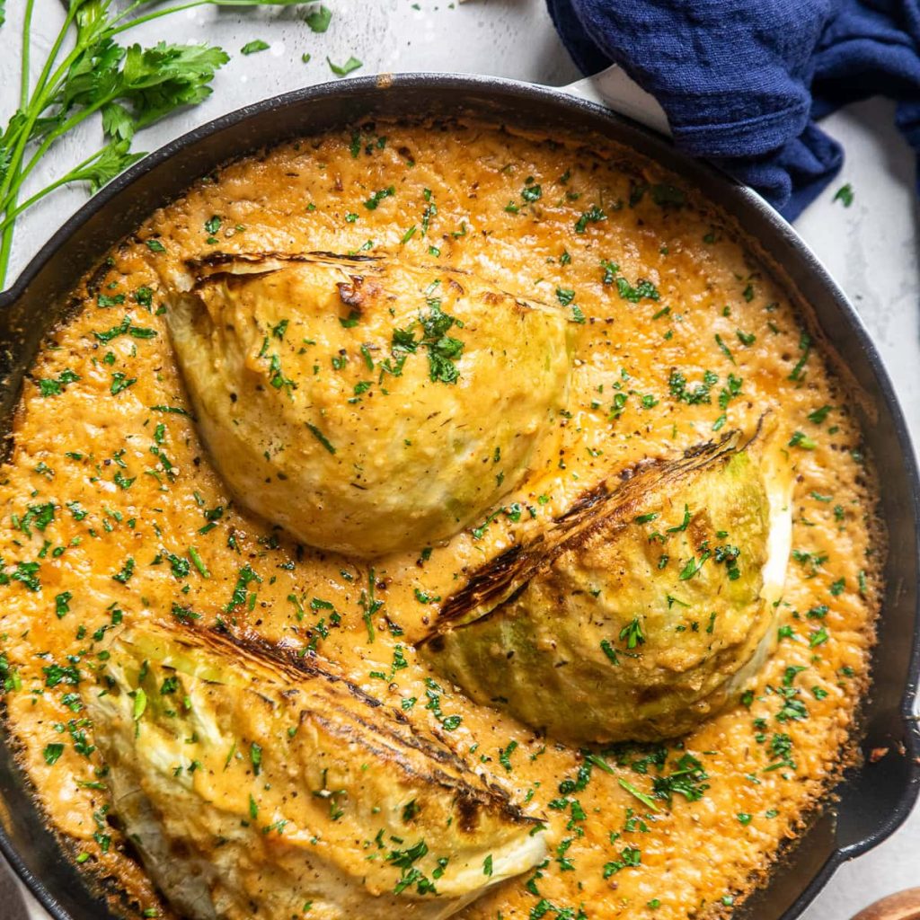 miso garlic melting cabbage in a cast iron skillet.