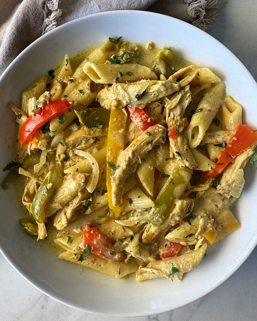 overhead shot of slow cooker Rasta pasta in a white bowl