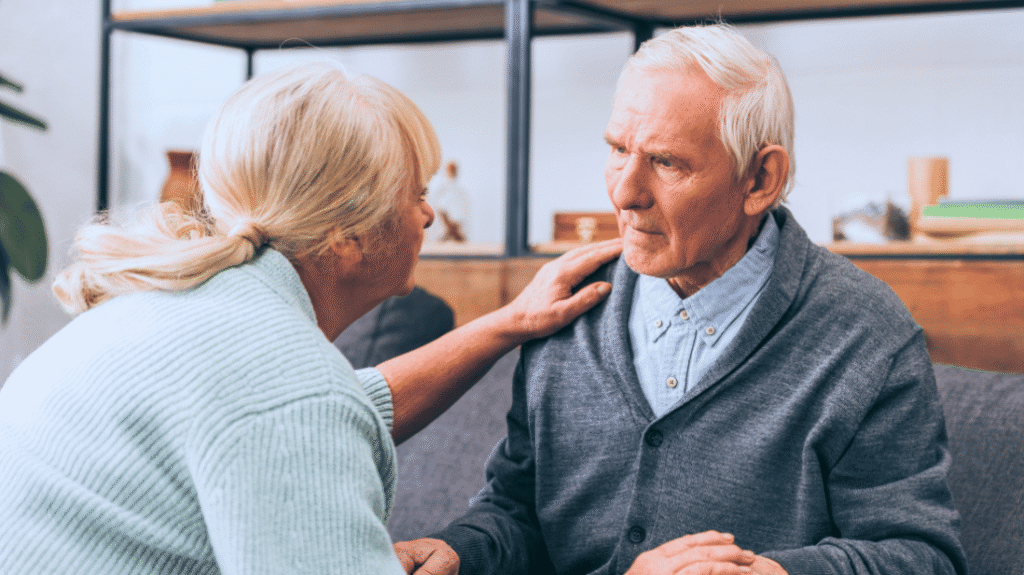 Senior woman trying to communicate with husband who has dementia