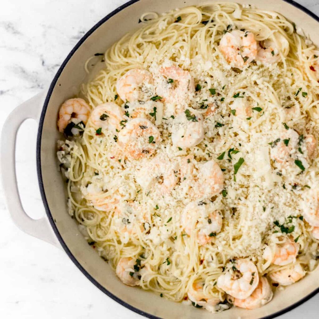 Four process photos to make scampi on pin with text overlay.