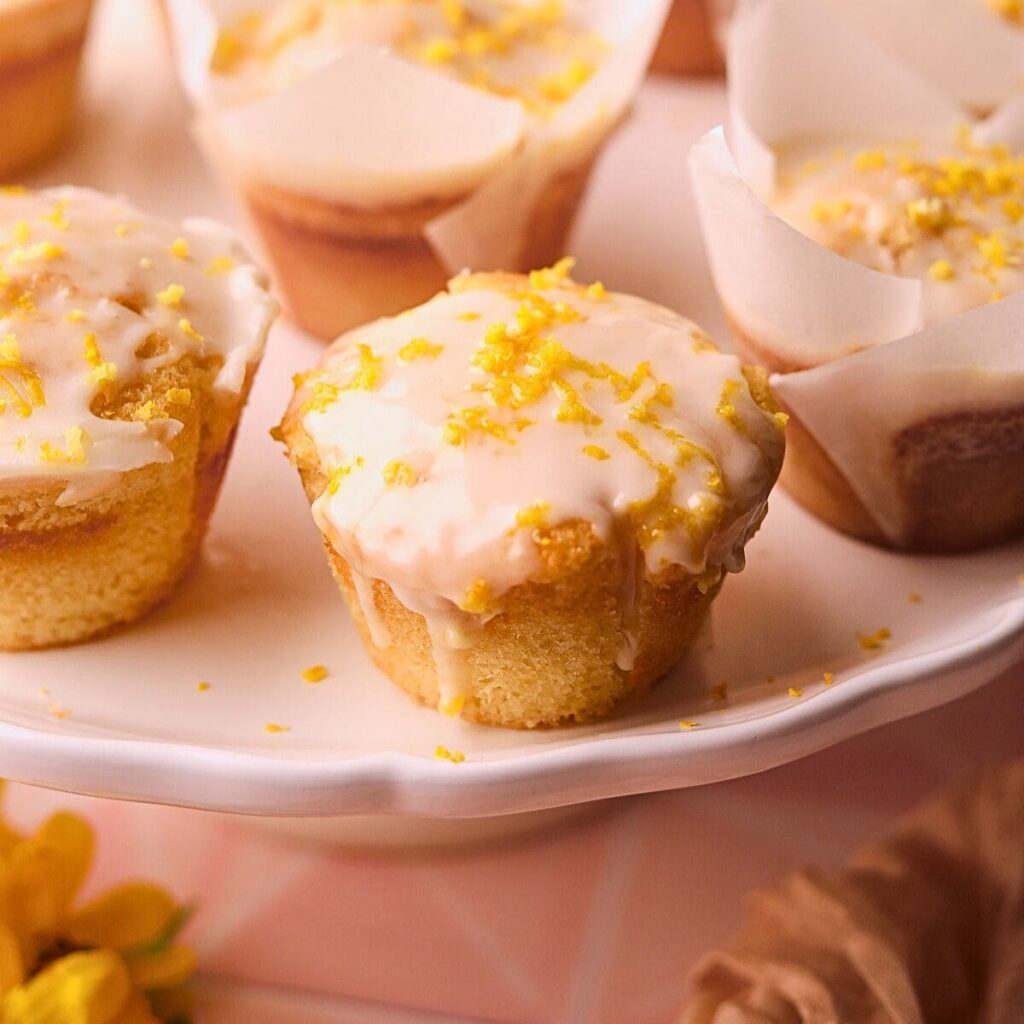 Bakery-Style Lemon Cream Cheese Muffins Lemon cream cheese muffins on a serving platter.