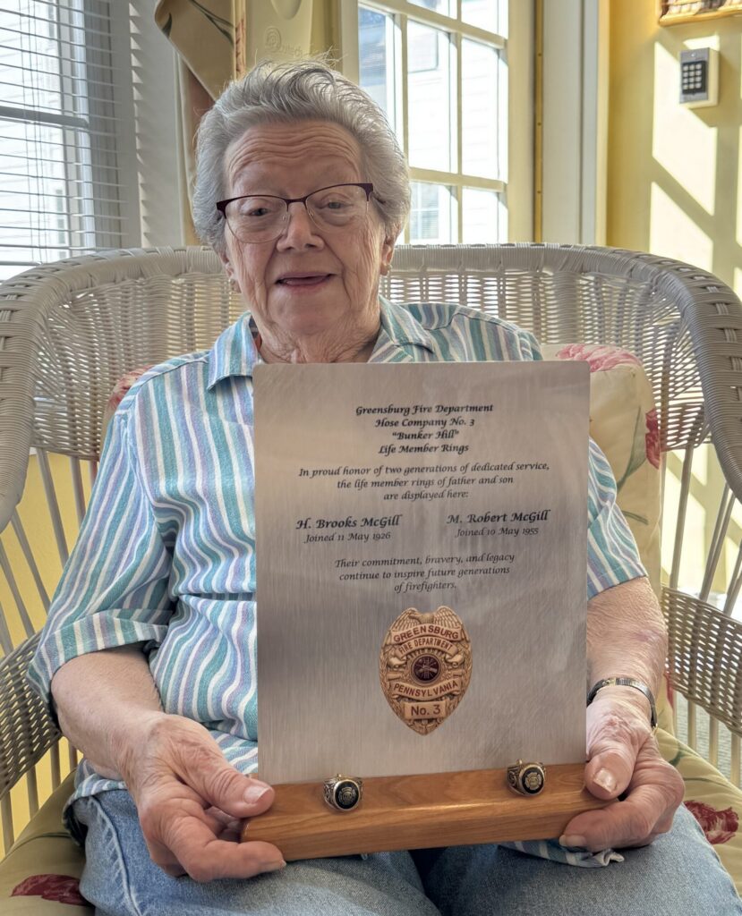 Bert McGill with Greensburg Fire Dept rings and plaque