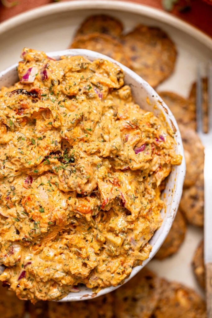 Creamy Herb Roasted Salmon Dip Up close shot of Creamy Herb Roasted Salmon Dip in a bowl.