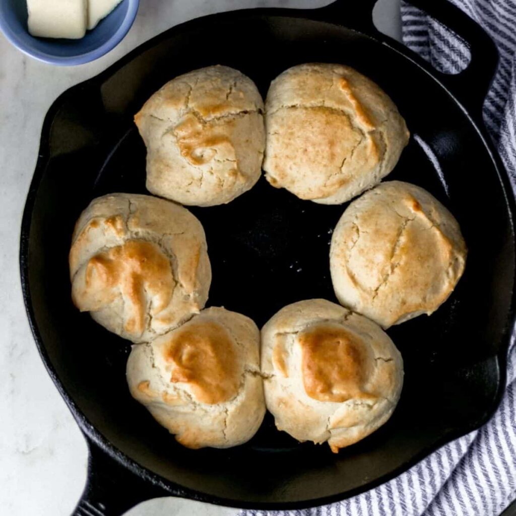 Mayonnaise Biscuits Recipe (Easy Drop Biscuits) Two photos of finished biscuits in skillet on pin with text overlay.